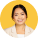 girl standing in yellow background